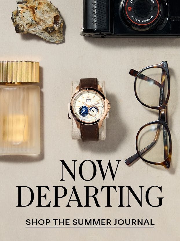 Flat lay of luxury travel essentials featuring a pre-owned Girard-Perregaux moonphase watch, vintage camera, designer glasses, and fragrance—evoking refined summer departure style.