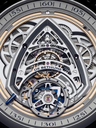A detailed view of the intricate movement and tourbillon of the De Bethune DB Kind of Two Jumping GMT watch, highlighting the sophisticated mechanical design, available at The 1916 Company.