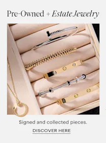 Collection of pre-owned Cartier bracelets and necklaces in jewelry box