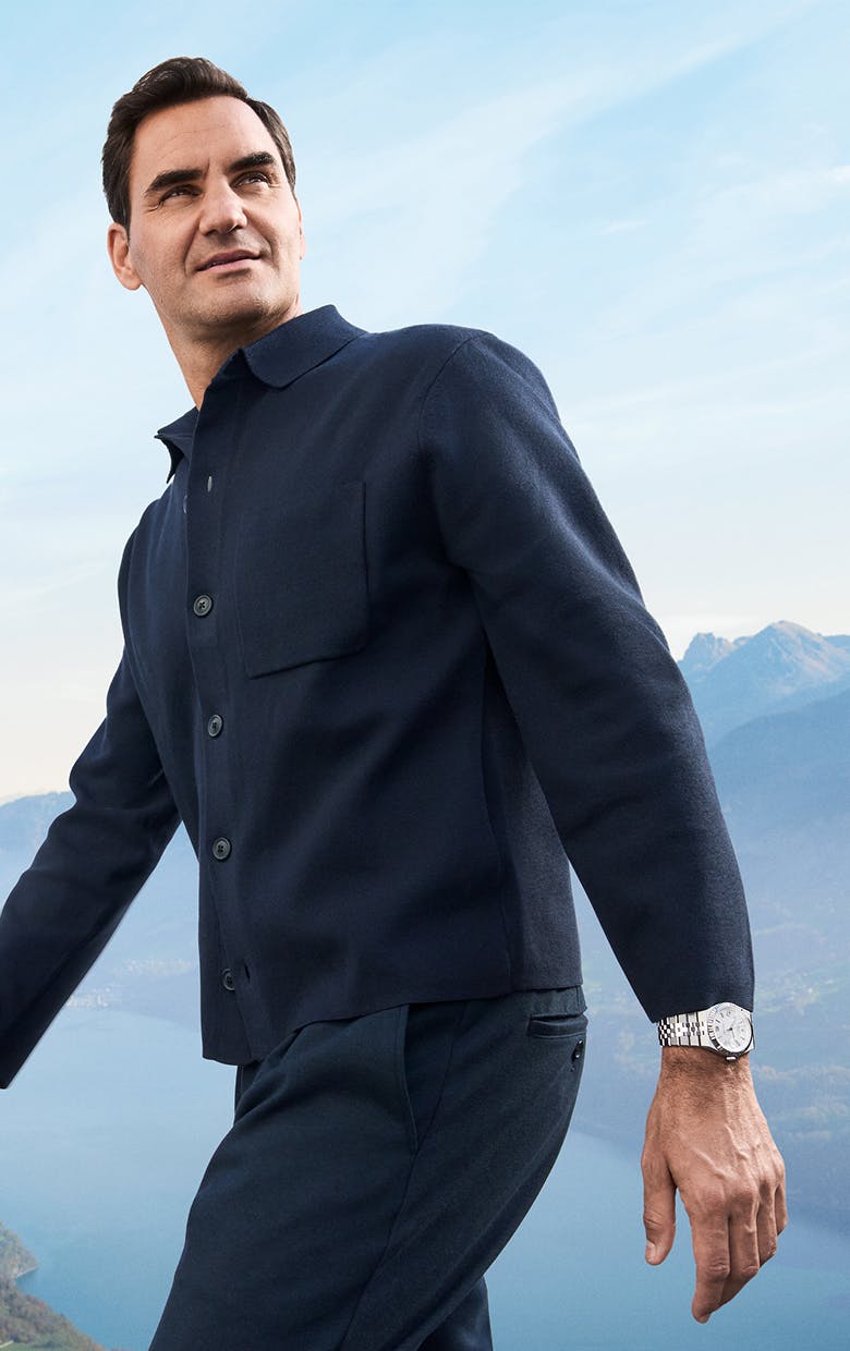 A man wearing silver Rolex Land-Dweller 