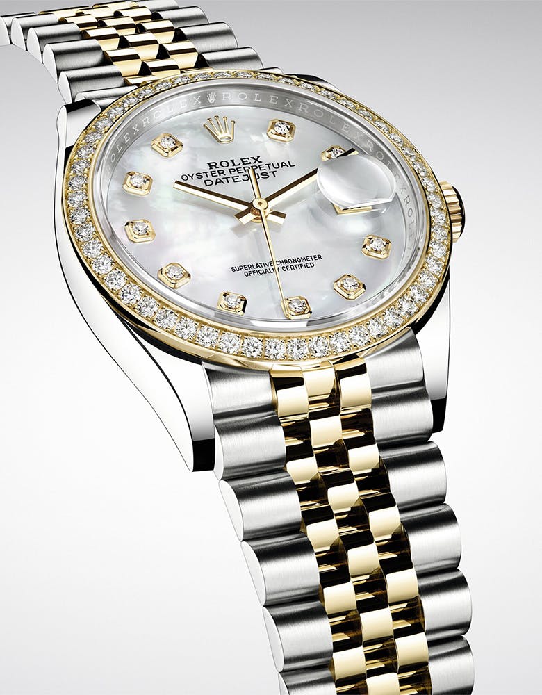 Close-up of a Rolex Datejust, highlighting its refined dial and the iconic fluted bezel in a luxurious presentation.